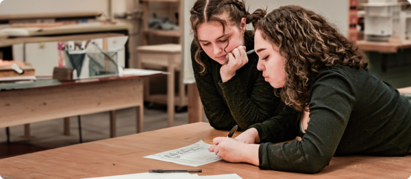 Two students work on their design project.